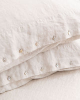 Beige linen pillowcase with buttons